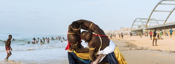 Two La Lutte athletes on the beach in Dakar wearing damask from Getzner.