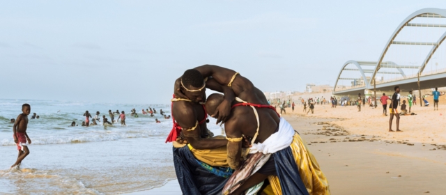 Two La Lutte athletes on the beach in Dakar wearing damask from Getzner.